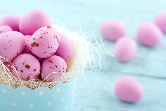Pink easter eggs in a blue cupcake cup