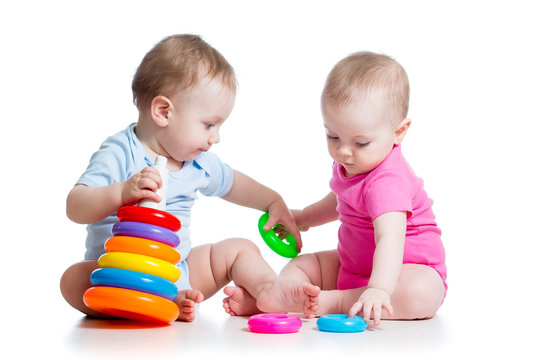 kids boy and girl playing toys together