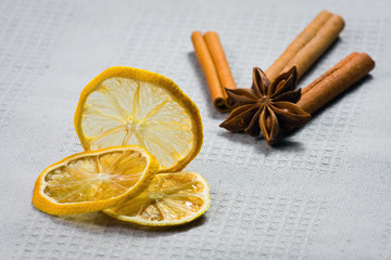cinnamon sticks, anise stars and sliced of dried citrus