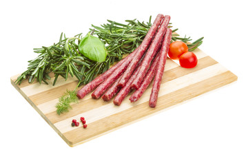 Salami with rosemary, basil and tomato
