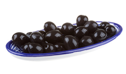 Olives black watered with olive oil in a bowl isolated on a whit