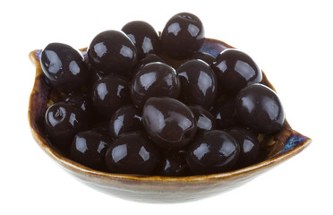 Olives black watered with olive oil in a bowl isolated on a whit