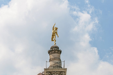 Fototapeta na wymiar Mercury statue at Schlossplatz, Germany