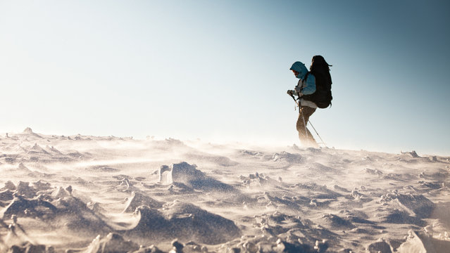 Hiker in winter mountains