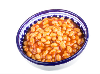 Marinated haricot beans in tomato sauce with shallots on a plate