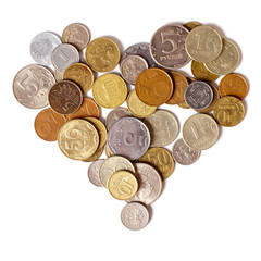 Coins are in the shape of a heart on a white background