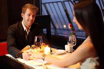The restaurant guy holding a beautiful Brunette by the hand