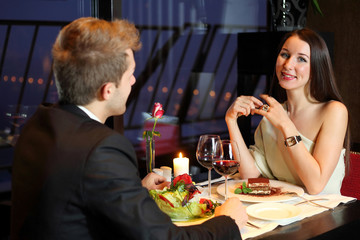 Beautiful girl and young boy met at a restaurant for dinner