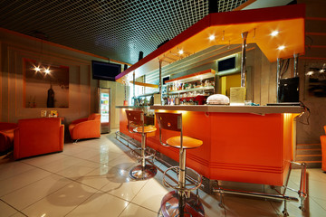 Empty cafe-bar interior in orange tones