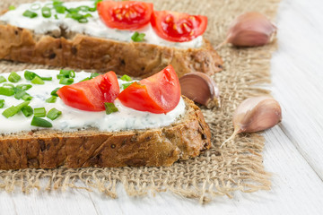 Two sandwiches with cream cheese