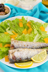 fried sardines with lemon and salad