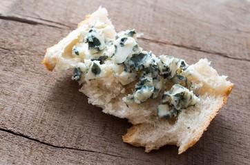 Roquefort spread on a slice of bread.