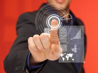 handsome man in suit pressing virtual button