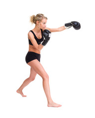 Fototapeta premium Young woman with boxing gloves at workout