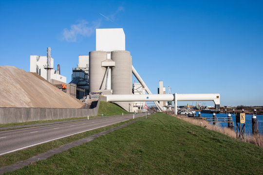 Big cement factory near a canal in the Netherlands