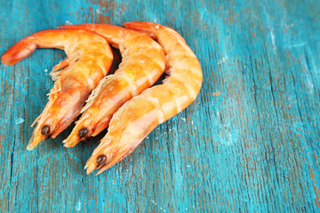 Shrimps on blue wooden table