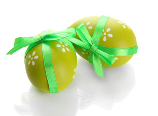 Bright easter eggs with bows, isolated on white