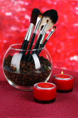 Glass bowl with coffee beans,brushes and candles