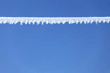 Airplane tracks in the blue sky