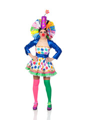 Funny girl clown with a big colorful wig