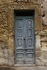 Fototapeta na wymiar Old door and stone wall