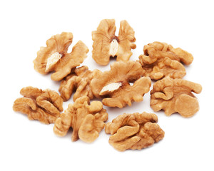 Heap of fresh shelled walnuts on white background. Close-up.