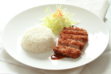 japanese fried pork with rice on white round plate