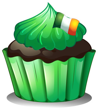 A green cupcake with the flag of Ireland