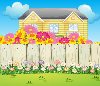 A house surrounded with colorful flowers