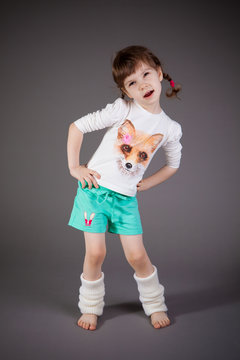 little girl on gray background