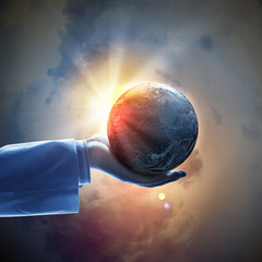 Image of earth planet on hand