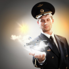 Image of pilot with plane in hand