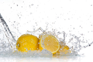 Lemon with water splash isolated on white