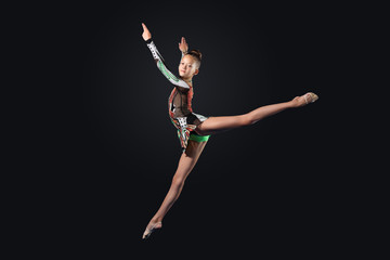 Fototapeta premium Young woman in gymnast suit posing