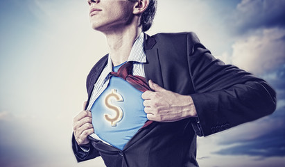 Businessman showing superman suit underneath shirt - obrazy, fototapety, plakaty