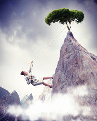 businesswoman climbing mountain