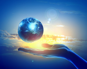 Image of earth planet on hand
