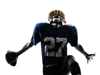 Foto op Canvas triumphant american football player man silhouette © snaptitude