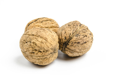 dried walnuts on white background