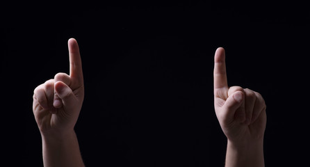 Two fingers on the black background