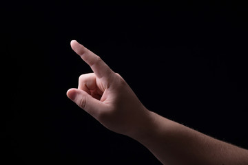 One finger on a black background