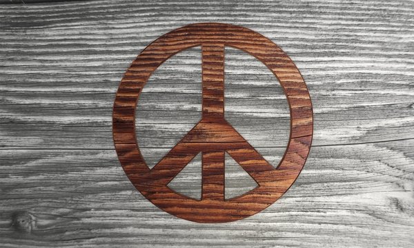 Classy peace symbol in a stylish wooden background