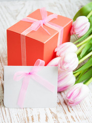Bunch of tulips with present cart and gift box