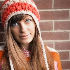 Portrait of young pretty funny smiling girl in cold weather