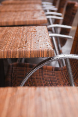 Cafe chairs under the rain.
