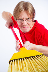 Angry man with broom