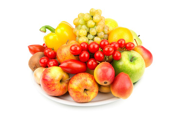 fruits and vegetables on a plate isolated on white background