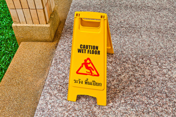 Wet floor caution sign on floor