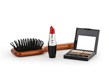 Red lipstick, powder and comb