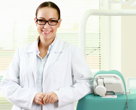 woman dentist at her office smiling